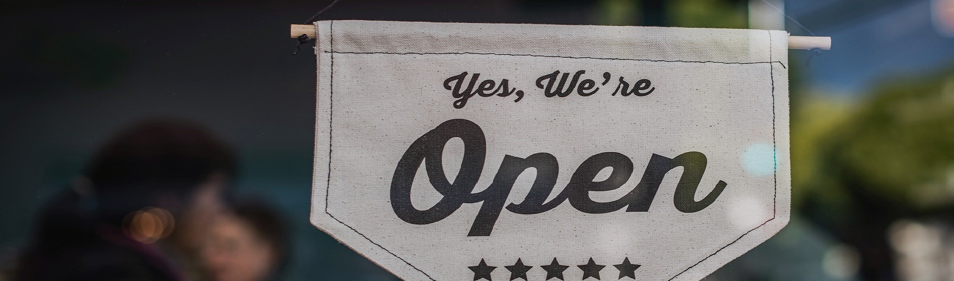 open sign hanging in window