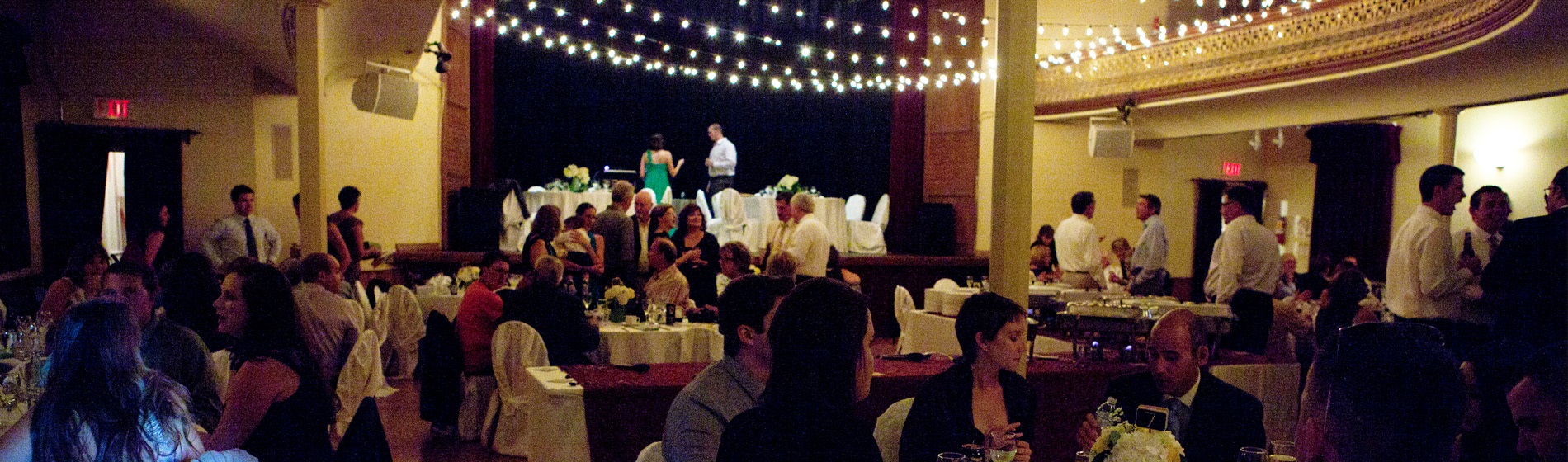 interior of music hall decorated and filled with people celebrating