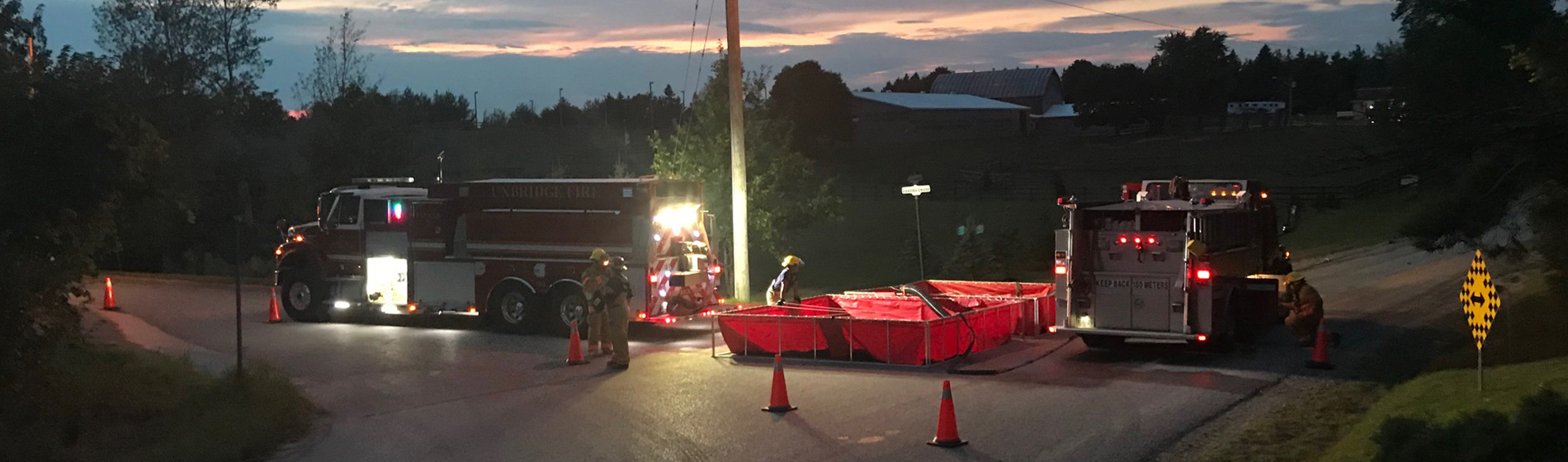 fire trucks at dusk