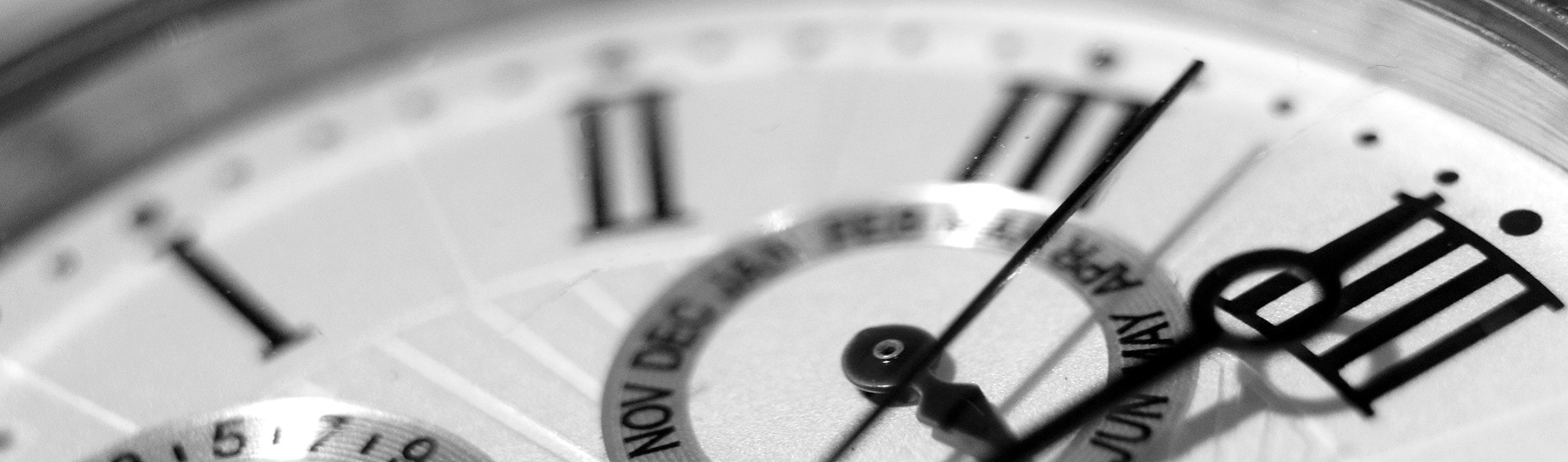 close up of hands on clock face nearing 12 o'clock